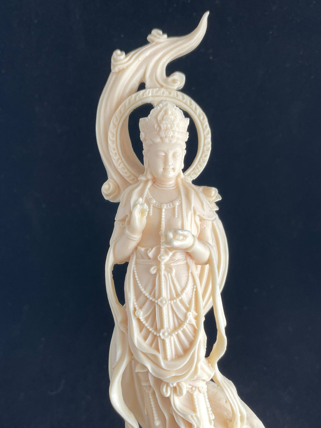 Palm nut Guan Yin on lotus and clouds 8.1"