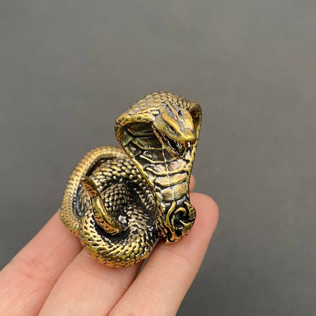 Miniature brass cobra snake figurine