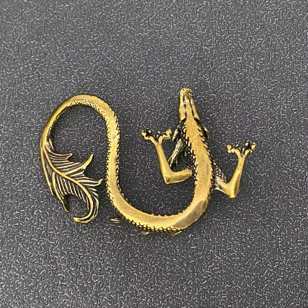 Miniature brass dragon shelf decor