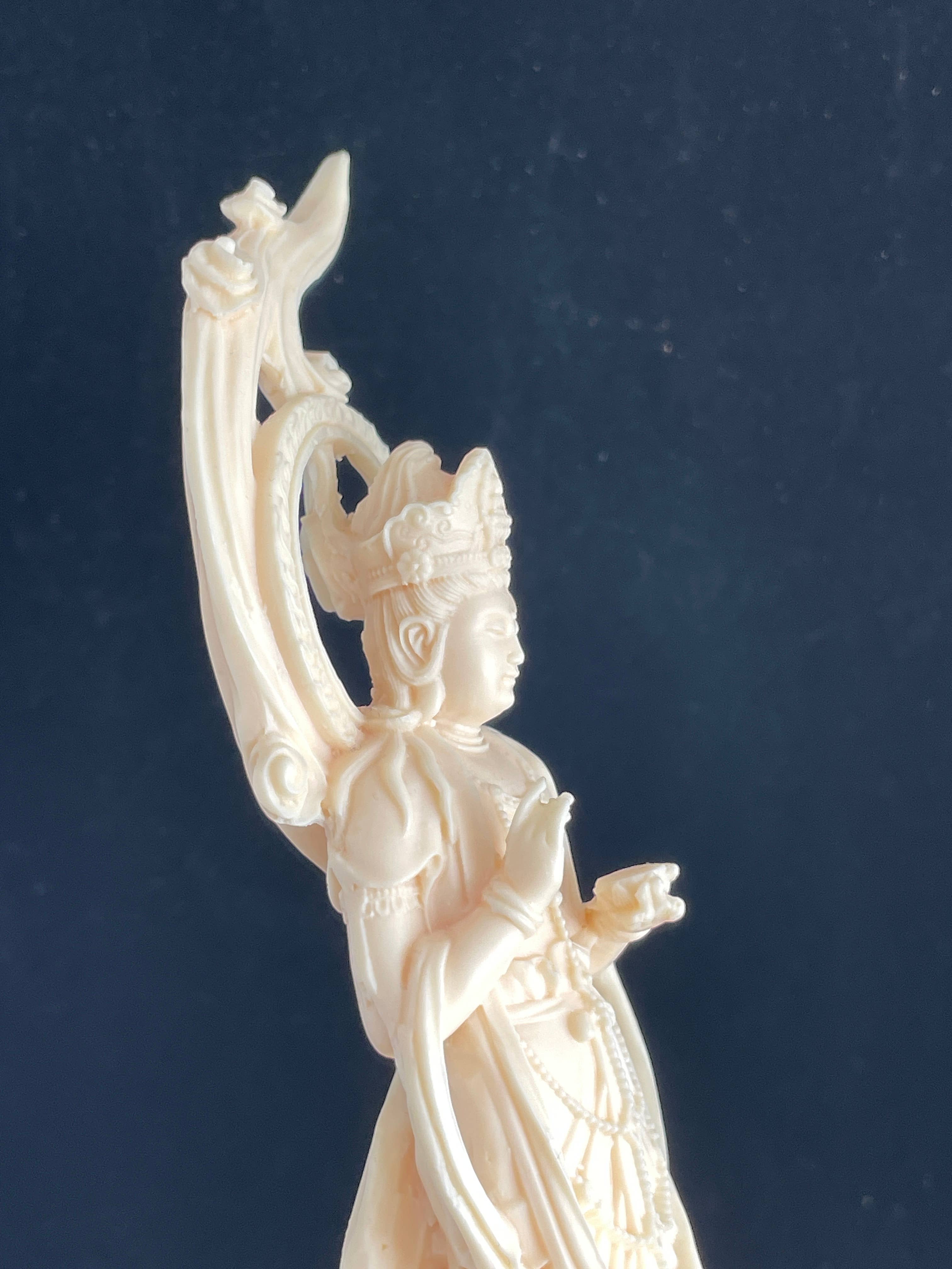 Palm nut Guan Yin on lotus and clouds 8.1"