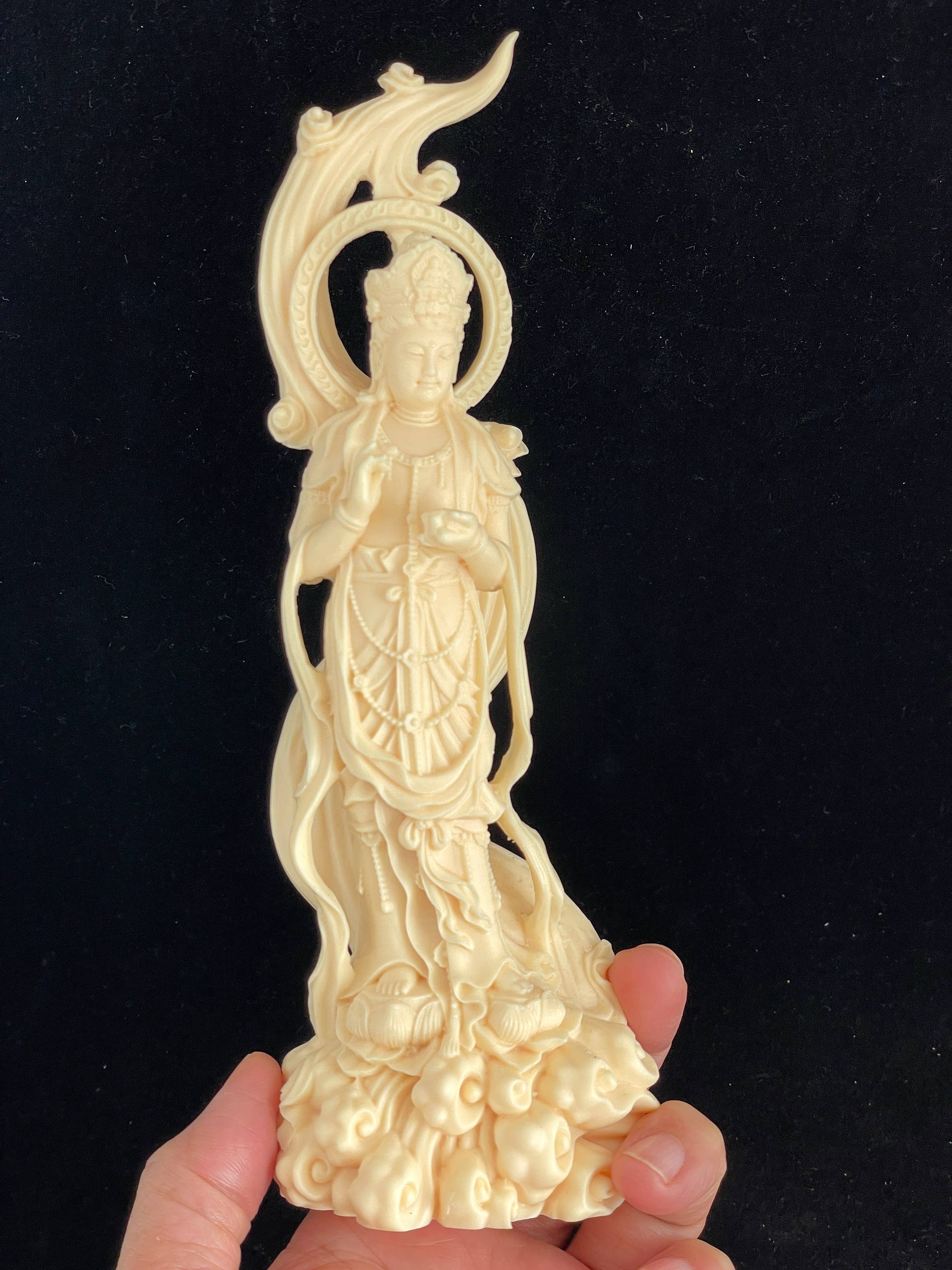 Palm nut Guan Yin on lotus and clouds 8.1"