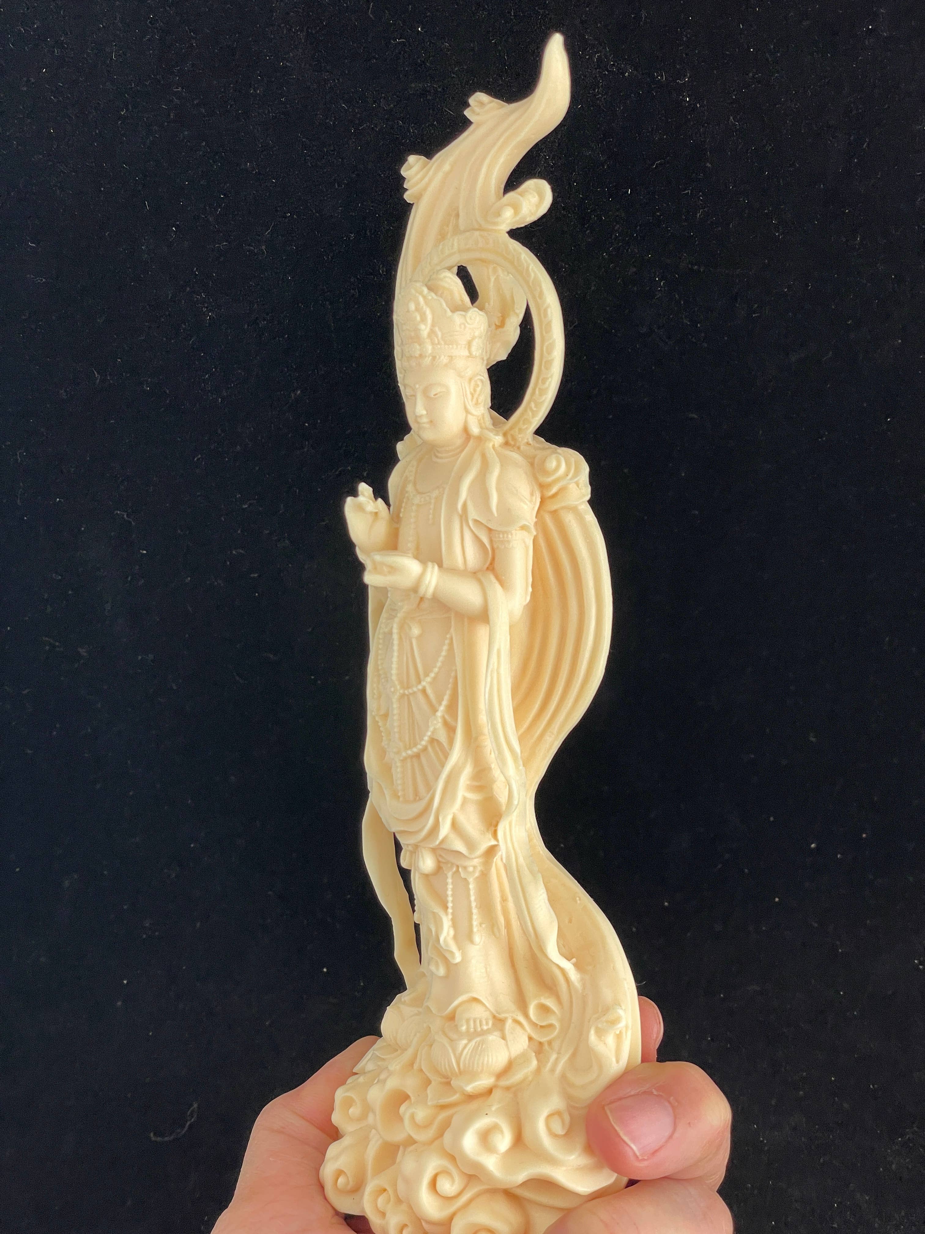 Palm nut Guan Yin on lotus and clouds 8.1"