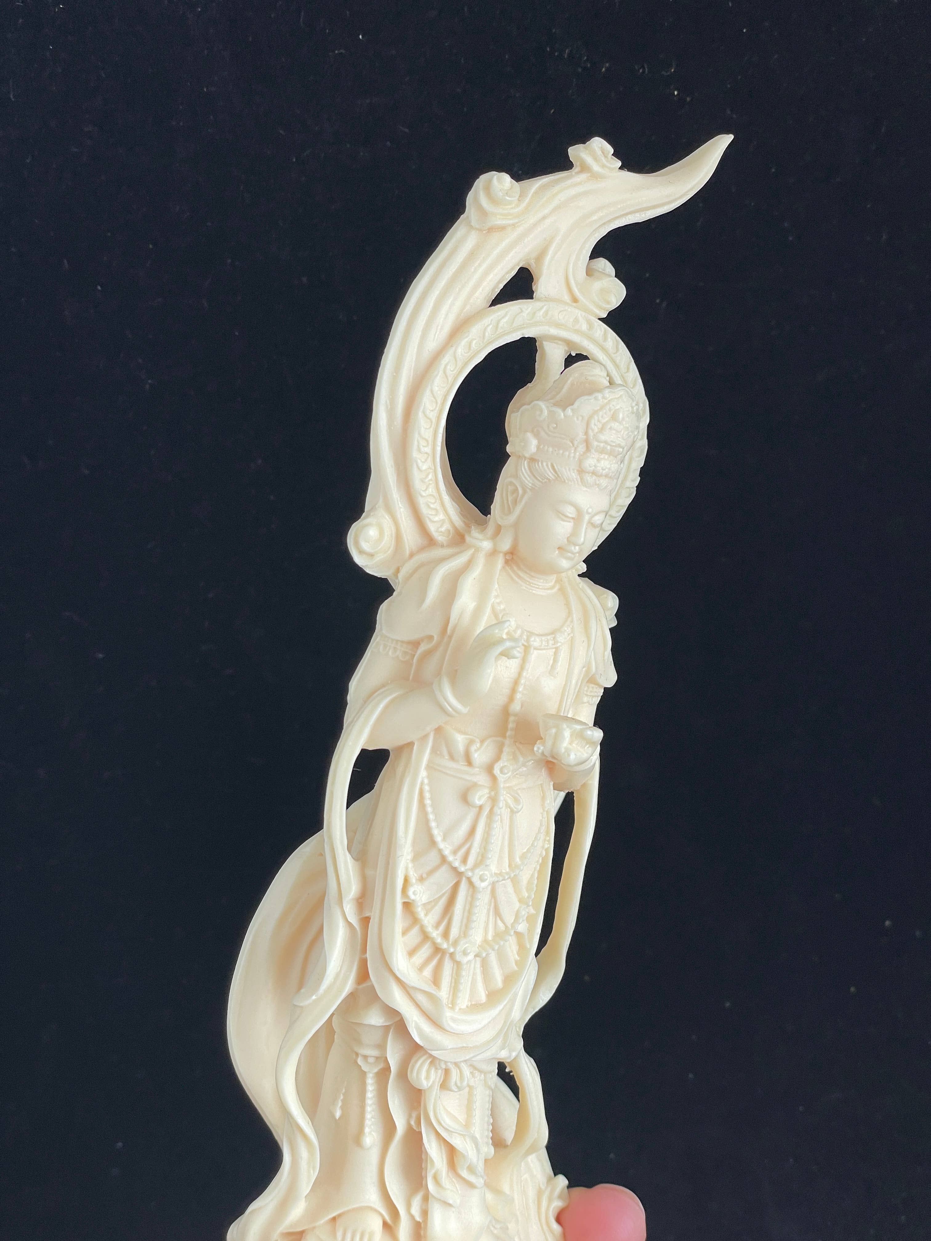 Palm nut Guan Yin on lotus and clouds 8.1"
