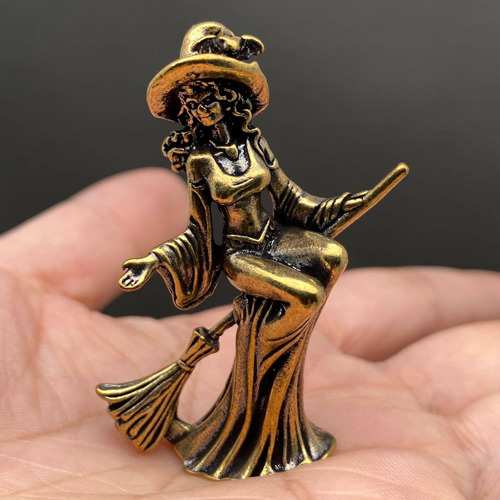 Miniature brass witch figurine